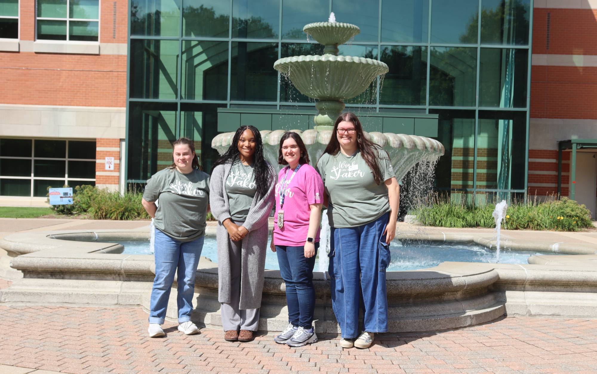 group of students in front of gvsu sign